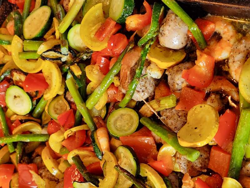 Sheet Pan Sausage & Veggies with Cajun Butter Sauce · Easy Family